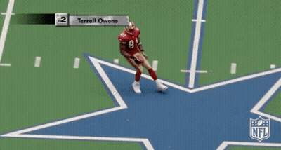 A Football Game Between The Cowboys And The Cardinals With Terrell Owens On The Field GIF