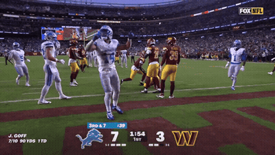 A Football Game Between The Detroit Lions And The Redskins GIF