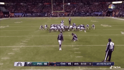 A Football Game Between The Eagles And The Patriots GIF