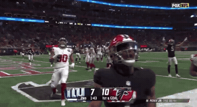 A Football Game Between The Giants And The Falcons GIF