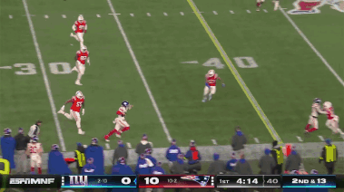 A Football Game Between The Giants And The Patriots Is Going On GIF