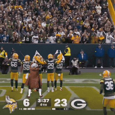 A Football Game Between The Green Bay Packers And The Minnesota Vikings Is Being Played GIF