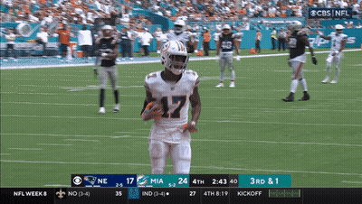 A Football Game Between The Miami Dolphins And The New England Patriots On Cbs GIF
