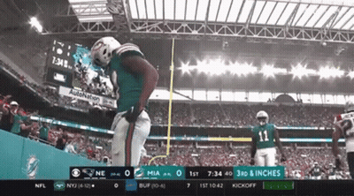 A Football Game Between The Miami Dolphins And The New York Jets Is Being Broadcast On Cbs GIF