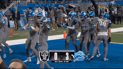 A Football Game Between The Raiders And The Lions GIF