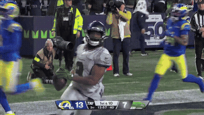 A Football Game Between The Rams And The Seahawks Is Being Played GIF