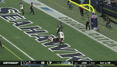 A Football Game Between The Seahawks And The Cowboys GIF