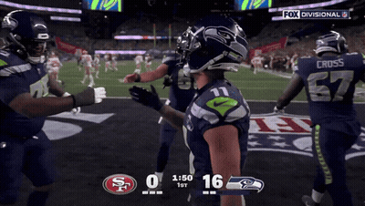 A Football Game Between The Seahawks And The San Francisco 49Ers GIF