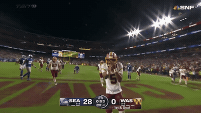 A Football Game Between The Seahawks And The Was GIF
