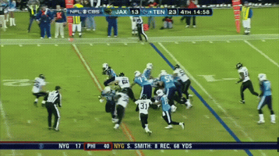 A Football Game Between The Titans And The Ravens GIF