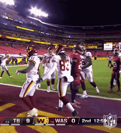 A Football Game Between The Washington Redskins And The Denver Broncos GIF