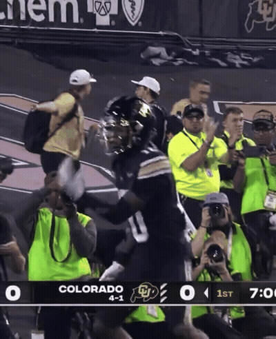A Football Game Is Being Played Between Colorado And Ucla GIF