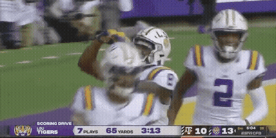 A Football Game Is Being Played Between Lsu And Texas Tech GIF