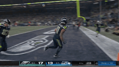 A Football Game Is Being Played Between Seattle Seahawks And Eagles GIF