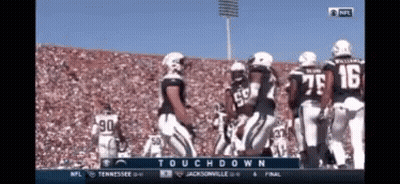 A Football Game Is Being Played Between Tennessee And Jacksonville On A Television Screen GIF