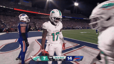 a football game is being played between the dolphins and bills