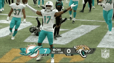 A Football Game Is Being Played Between The Dolphins And Jaguars GIF