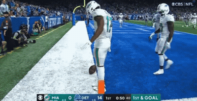 A Football Game Is Being Played Between The Miami And Detroit Dolphins GIF