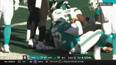 A Football Game Is Being Played Between The Miami Dolphins And New York Jets GIF