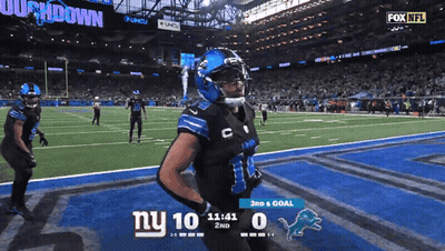 A Football Game Is Being Played Between The New York Giants And Detroit Lions GIF