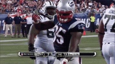 A Football Game Is Being Played Between The Patriots And The New York Jets GIF