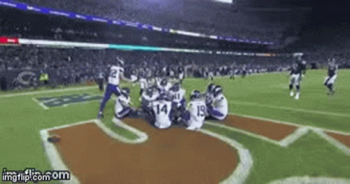 A Football Game Is Being Played In A Stadium And A Gif Is Being Displayed On Imgflip.com GIF