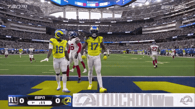 A Football Game Is Being Played In A Stadium And The Score Is 0 To 0 GIF