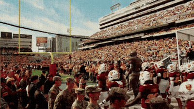 A Football Game Is Being Played In A Stadium That Has A Sign That Says ' Toyota ' On It GIF