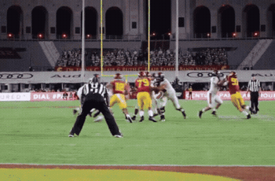 A Football Game Is Being Played In A Stadium That Has Ads For Audi GIF