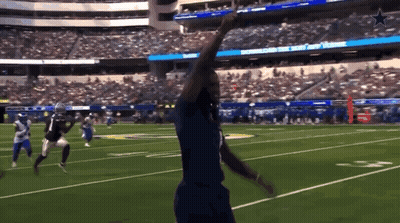 A Football Game Is Being Played In A Stadium That Has The Word Cowboys On The Scoreboard GIF