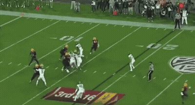 A Football Game Is Being Played In A Stadium With A Banner That Says Sunflower On It GIF