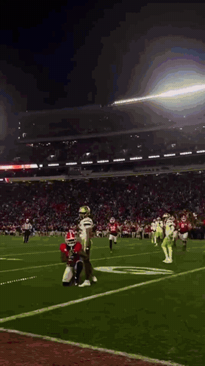 A Football Game Is Being Played In A Stadium With A Few Players On The Field GIF