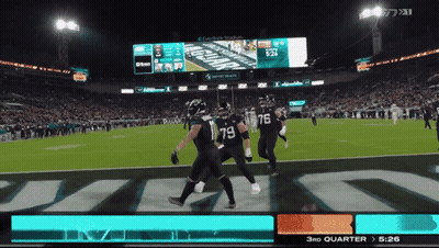 A Football Game Is Being Played In A Stadium With A Scoreboard That Says Jaguars On It GIF