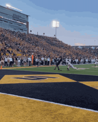 A Football Game Is Being Played In A Stadium With The Letter G On The Field GIF