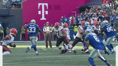 A Football Game Is Being Played In Front Of A Large T Mobile Sign GIF