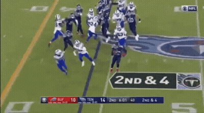 A Football Game Is Being Played On A Field And A Player Is Being Lifted By A Target . GIF