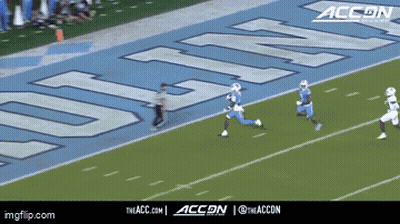 A Football Game Is Being Played On A Field That Has The Word Accn On It GIF