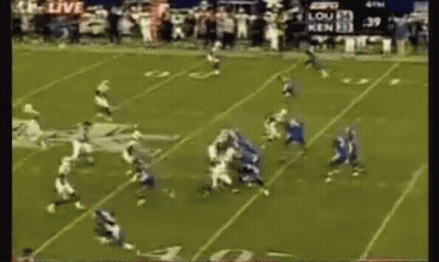 A Football Game Is Being Played On A Field With A Scoreboard That Says 39 GIF