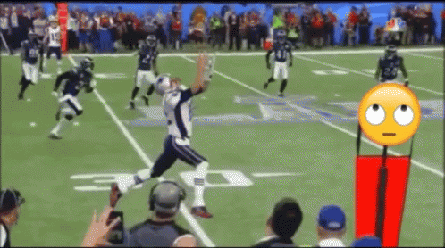 A Football Game Is Being Played On A Field With A Smiley Face In The Middle GIF
