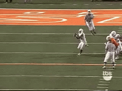 A Football Game Is Being Played On A Field With Tbs Written On The Sidelines GIF
