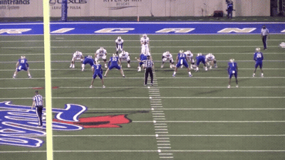 A Football Game Is Being Played On A Field With The Number 50 On The Sidelines GIF