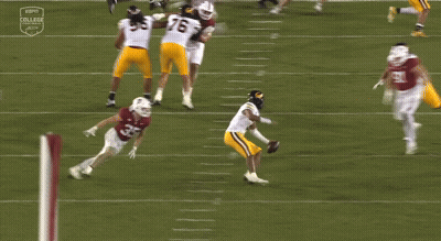 A Football Game Is Being Played On Espn College GIF