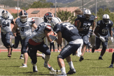 A Football Game Is Being Played With A Player Wearing Number 22 GIF