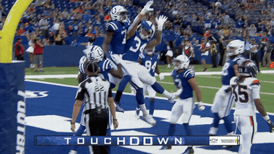 A Football Game Is Being Played With The Words Touchdown On The Bottom GIF