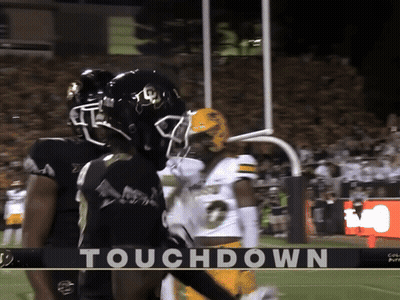 A Football Game Is Underway And The Word Touchdown Is On The Bottom GIF