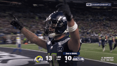 A Football Player Celebrates A Touchdown During A Fox Championship Game GIF