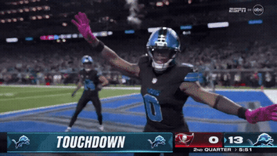 A Football Player Celebrates A Touchdown During A Game On Espn GIF