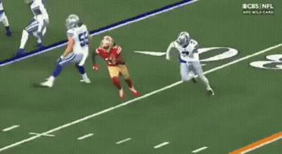 A Football Player In A 49Ers Uniform Is Running Down The Field GIF