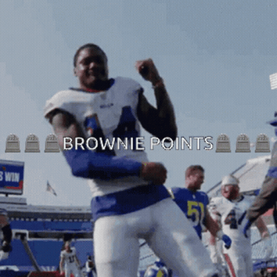 A Football Player In A Blue And White Uniform With The Words Brownie Points Above Him GIF