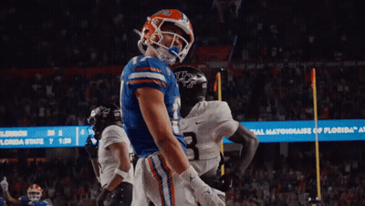 A Football Player In A Blue Jersey With The Number 1 On The Back GIF